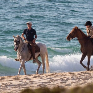 Exclusif - Madonna fait une balade à cheval sur la plage de Comporta avec son fils David, le 8 octobre 2017.