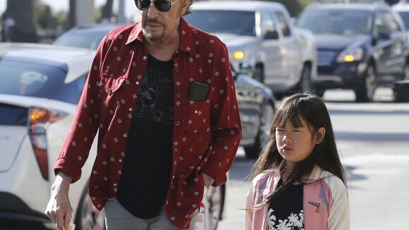Johnny Hallyday : Papa assoupi avec sa fille Joy, tendre photo souvenir