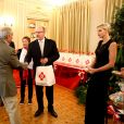 Le prince Albert II de Monaco et la princesse Charlène lors de la traditionnelle distribution des colis de Noël de la Croix-Rouge à Monaco le 17 novembre 2017. © Olivier Huitel / Pool Restreint Monaco / Bestimage