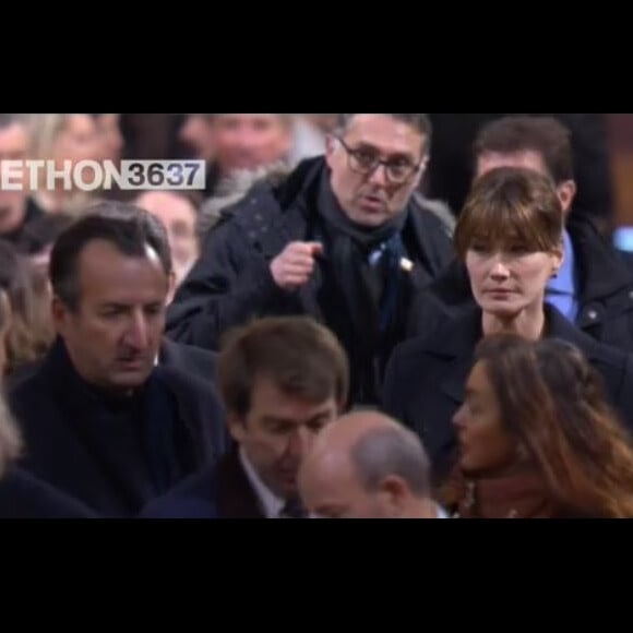 Carla Bruni et Nicolas Sarkozy  arrivent à l'église de la Madeleine pour les obsèques de Johnny Hallyday, à Paris le 9 décembre 2017.