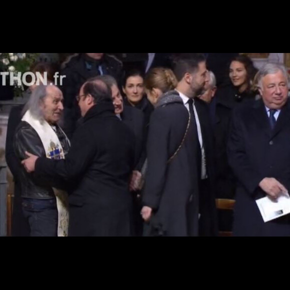 François Hollande arrivent à l'église de la Madeleine pour les obsèques de Johnny Hallyday, à Paris le 9 décembre 2017.