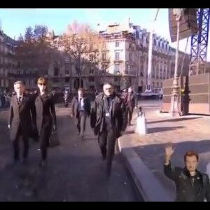 Nicolas Sarkozy et Carla Bruni arrivent à l'église de la Madeleine pour les obsèques de Johnny Hallyday, à Paris le 9 décembre 2017.