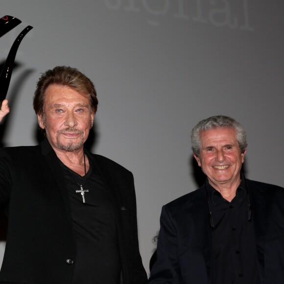 Johnny Hallyday et Claude Lelouch - Soirée d'ouverture du 6ème Festival International du Film Policier de Beaune avec un hommage à Johnny Hallyday pour l'ensemble de sa carrière cinématographique, le 2 avril 2014.