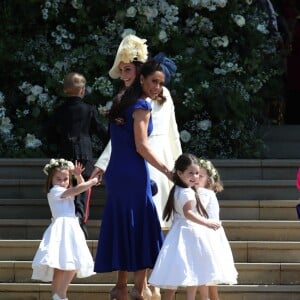 Kate Middleton, duchesse de Cambridge, accompagne la princesse Charlotte de Cambridge, le prince George de Cambridge et les autres flowergirls et pageboys pour la cérémonie de mariage du prince Harry et de Meghan Markle en la chapelle St George au château de Windsor, Royaume Uni, le 19 mai 2018.