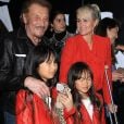 Johnny Hallyday, sa femme Laeticia et leurs filles Jade et Joy au vernissage de l'exposition du photographe Mathieu Cesar à Los Angeles. Le 21 février 2017.