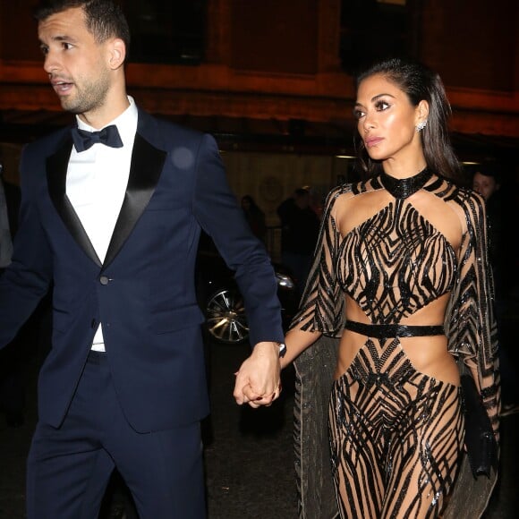 Nicole Scherzinger et son compagnon Grigor Dimitrov quittent la soirée des British Fashion Awards à Londres le 5 December 2016.