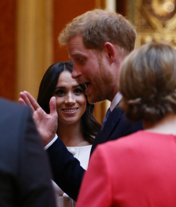Le prince Harry, duc de Sussex, Meghan Markle, duchesse de Sussex à la réception de la cérémonie des Queen's Young Leaders au palais de Buckingham à Londres le 26 juin 2018.