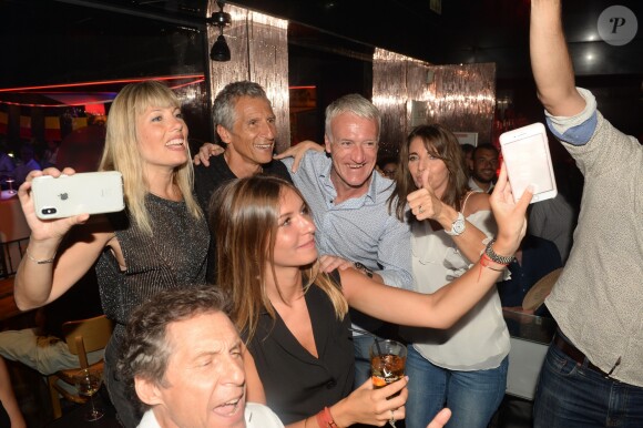 Semi-Exclusif - Didier Deschamps fête sa victoire avec sa femme Claude, Nagui et sa femme Mélanie Page et des amis à la Gioia et au VIP Room à Saint-Tropez, le 21 juillet 2018. © Rachid Bellak/Bestimage