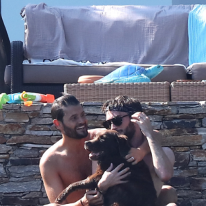 Exclusif - Christophe Beaugrand et son mari Ghislain Gerin en vacances avec des amis et leur chienne Colby à Saint-Tropez le 31 juillet 2018.