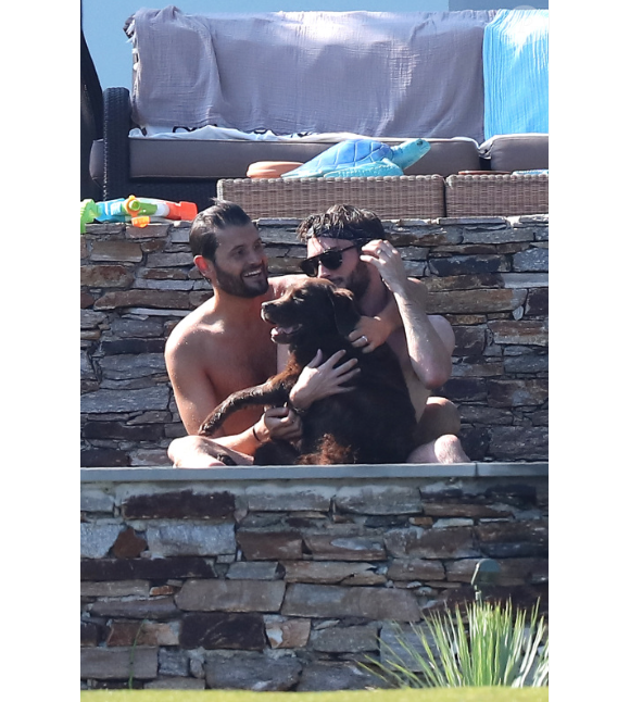 Exclusif - Christophe Beaugrand et son mari Ghislain Gerin en vacances avec des amis et leur chienne Colby à Saint-Tropez le 31 juillet 2018.