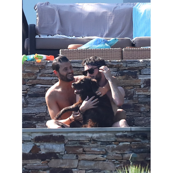 Exclusif - Christophe Beaugrand et son mari Ghislain Gerin en vacances avec des amis et leur chienne Colby à Saint-Tropez le 31 juillet 2018.