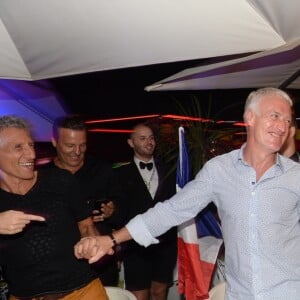 Semi-Exclusif - Didier Deschamps fête sa victoire avec sa femme Claude, Nagui et sa femme Mélanie Page et des amis à la Gioia et au VIP Room à Saint-Tropez, le 21 juillet 2018. © Rachid Bellak/Bestimage