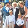 Lady Diana, le prince William et le prince Harry au cirque en août 1990.
