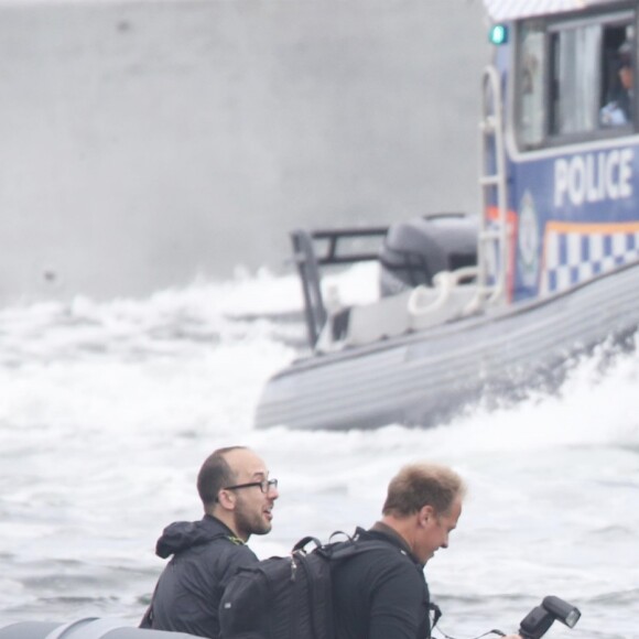 Le prince Harry, duc de Sussex, et Meghan Markle, duchesse de Sussex, enceinte, assistent à une régate lors des "Invictus Games 2018" à Sydney, le 21 octobre 2018.