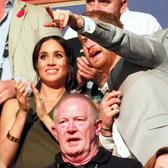 Le prince Harry, duc de Sussex, et Meghan Markle, duchesse de Sussex, enceinte, assistent à la cérémonie de clôture des Invictus Games 2018 à Sydney, le 27 octobre 2018.