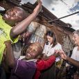 La princesse Mary de Danemark en visite dans le bidonville de Kibera à Nairobi, lors de son voyage au Kenya, avec des membres de la fondation Action, qui aide les enfants, les adolescents et les mères handicapées à une vie meilleure, le 28 novembre 2018.