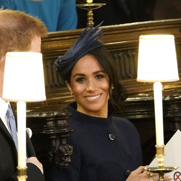 Meghan Markle (duchesse de Sussex), enceinte, et le prince Harry en la chapelle Saint-George au château de Windsor le 12 octobre 2018 lors du mariage de la princesse Eugenie d'York et de Jack Brooksbank.