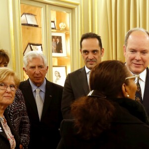 Le prince Albert II de Monaco et la princesse Charlene lors de la remise de colis de Noël à la Croix Rouge monégasque le 13 décembre 2018. © Jean-François Ottonello / Nice Matin / Bestimage  Prince Albert II of Monaco and princess Charlene at the Red Cross Christmas event in Monaco on december 13th 201813/12/2018 - Monaco