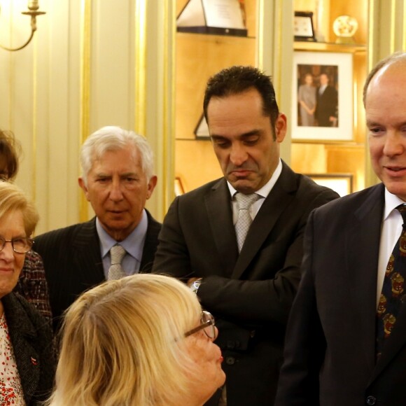 Le prince Albert II de Monaco et la princesse Charlene lors de la remise de colis de Noël dans les locaux de la Croix-Rouge monégasque le 13 décembre 2018. © Jean-François Ottonello / Nice-Matin / Bestimage