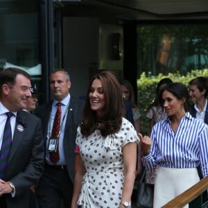 Catherine (Kate) Middleton, duchesse de Cambridge et Meghan Markle, duchesse de Sussex arrive à Wimbledon à l'occasion du tournoi de tennis "The Championships" à Londres le 14 juillet 2018