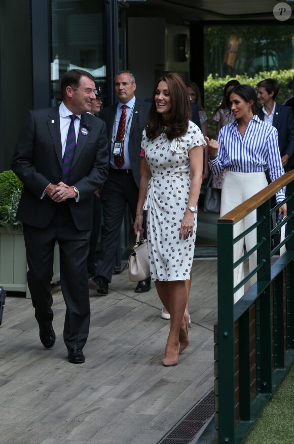 Catherine (Kate) Middleton, duchesse de Cambridge et Meghan Markle, duchesse de Sussex arrive à Wimbledon à l'occasion du tournoi de tennis "The Championships" à Londres le 14 juillet 2018