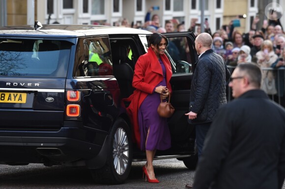 Le prince Harry, duc de Sussex, et Meghan Markle (enceinte), duchesse de Sussex, arrivent à Birkenhead, le 14 janvier 2019.
