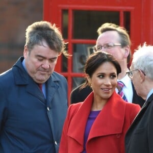 Le prince Harry, duc de Sussex, et Meghan Markle (enceinte), duchesse de Sussex, arrivent à Birkenhead, le 14 janvier 2019.