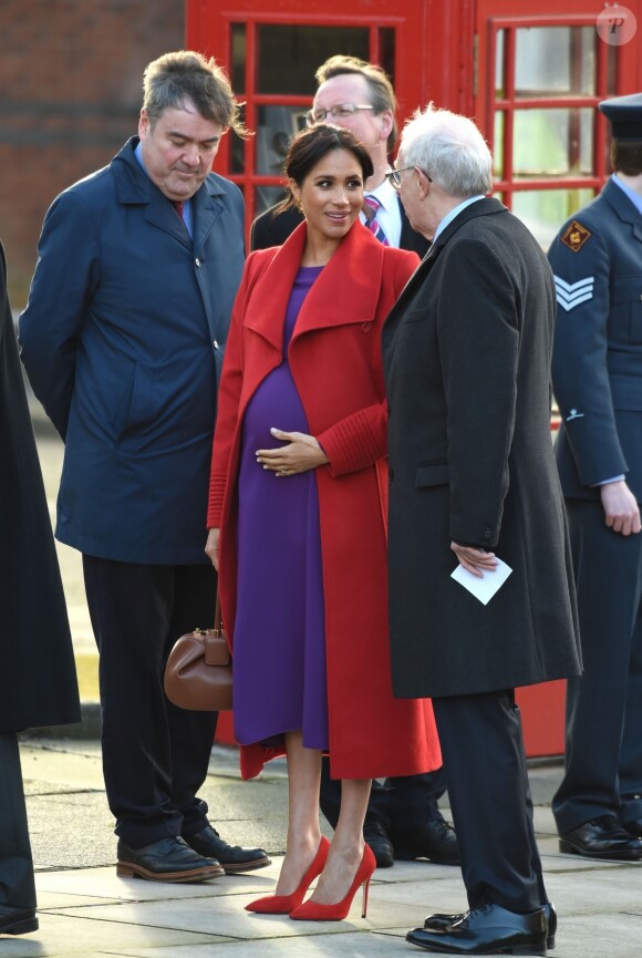 Le prince Harry, duc de Sussex, et Meghan Markle (enceinte), duchesse de Sussex, arrivent à Birkenhead, le 14 janvier 2019.