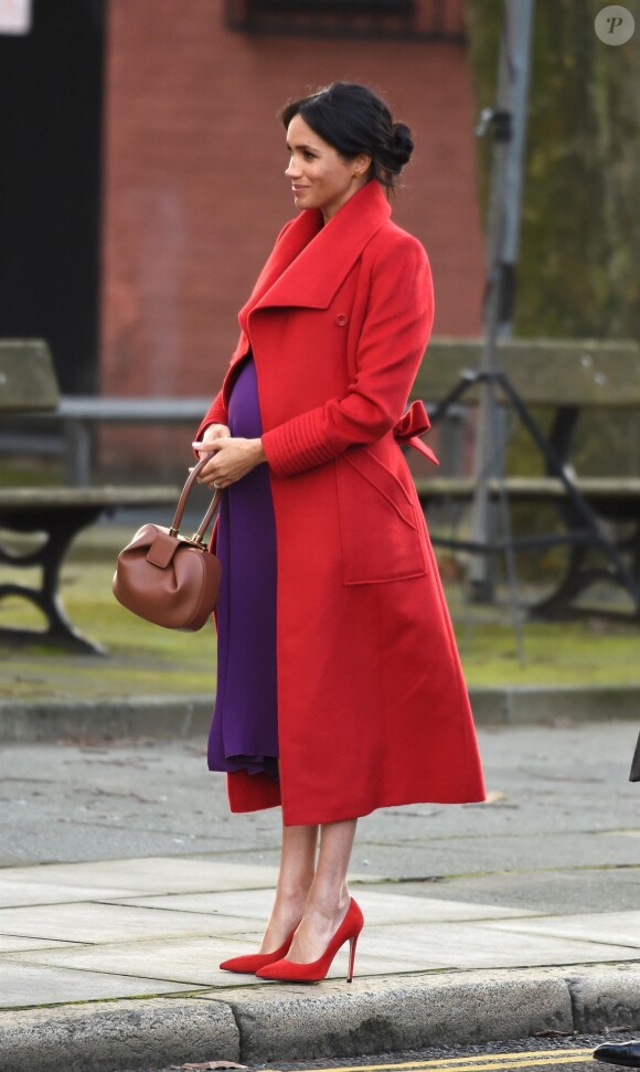 Le prince Harry, duc de Sussex, et Meghan Markle (enceinte), duchesse de Sussex, arrivent à Birkenhead, le 14 janvier 2019.