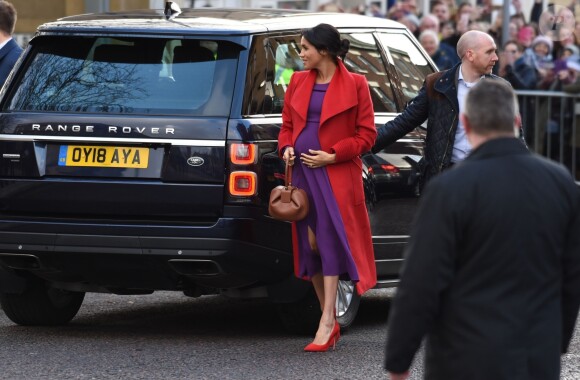 Le prince Harry, duc de Sussex, et Meghan Markle (enceinte), duchesse de Sussex, arrivent à Birkenhead, le 14 janvier 2019.