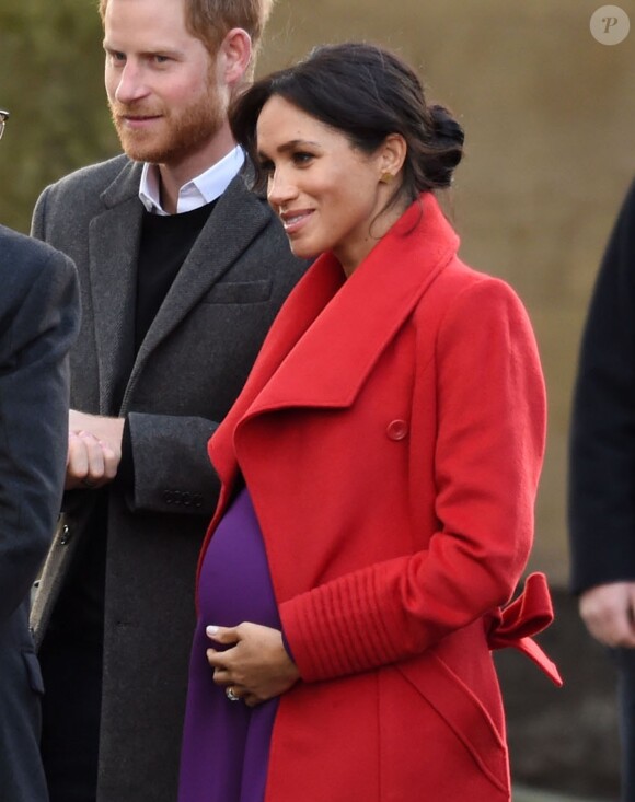 Le prince Harry, duc de Sussex, et Meghan Markle (enceinte), duchesse de Sussex, arrivent à Birkenhead, le 14 janvier 2019.