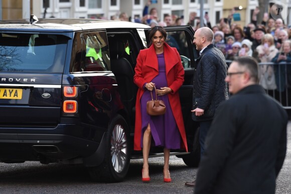 Le prince Harry, duc de Sussex, et Meghan Markle (enceinte), duchesse de Sussex, arrivent à Birkenhead, le 14 janvier 2019.