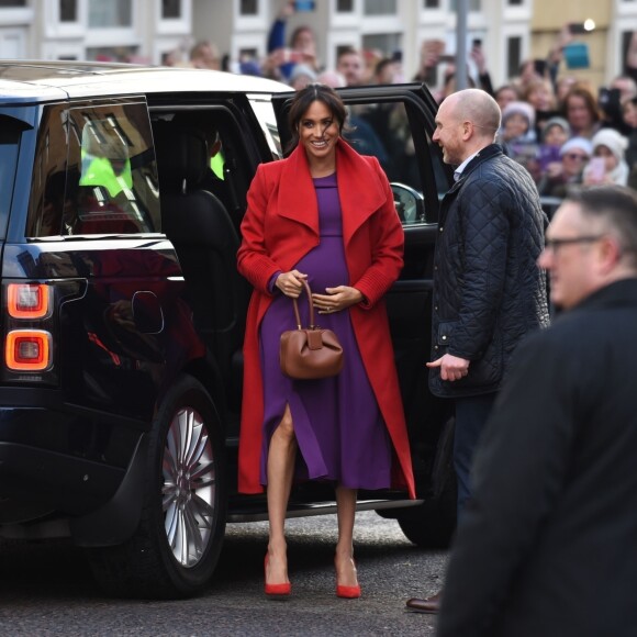 Le prince Harry, duc de Sussex, et Meghan Markle (enceinte), duchesse de Sussex, arrivent à Birkenhead, le 14 janvier 2019.