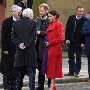 Le prince Harry, duc de Sussex, et Meghan Markle (enceinte), duchesse de Sussex, arrivent à Birkenhead, le 14 janvier 2019.