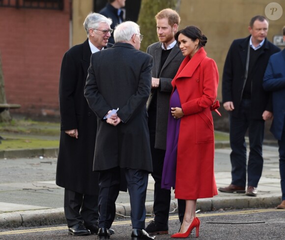 Le prince Harry, duc de Sussex, et Meghan Markle (enceinte), duchesse de Sussex, arrivent à Birkenhead, le 14 janvier 2019.