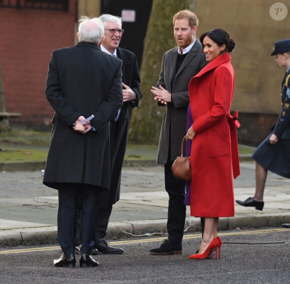 Le prince Harry, duc de Sussex, et Meghan Markle (enceinte), duchesse de Sussex, arrivent à Birkenhead, le 14 janvier 2019.