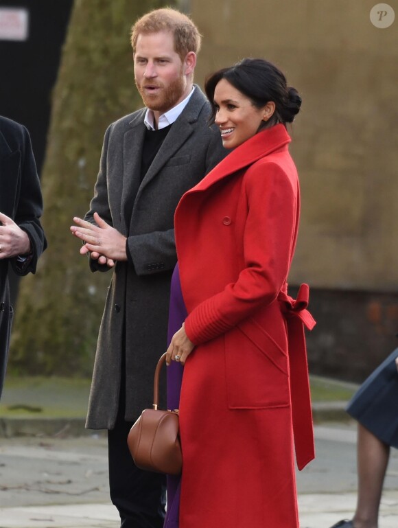 Le prince Harry, duc de Sussex, et Meghan Markle (enceinte), duchesse de Sussex, arrivent à Birkenhead, le 14 janvier 2019.