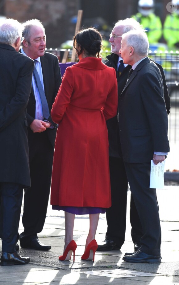 Le prince Harry, duc de Sussex, et Meghan Markle (enceinte), duchesse de Sussex, arrivent à Birkenhead, le 14 janvier 2019.