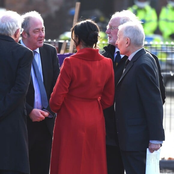 Le prince Harry, duc de Sussex, et Meghan Markle (enceinte), duchesse de Sussex, arrivent à Birkenhead, le 14 janvier 2019.