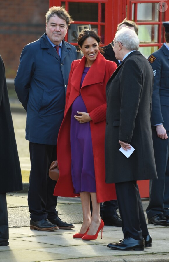 Le prince Harry, duc de Sussex, et Meghan Markle (enceinte), duchesse de Sussex, arrivent à Birkenhead, le 14 janvier 2019.