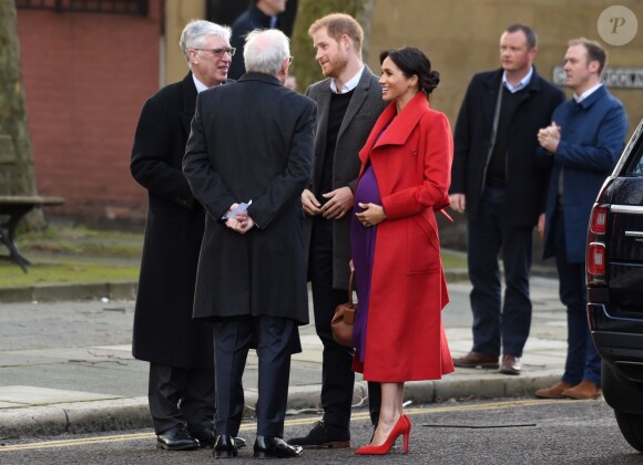 Le prince Harry, duc de Sussex, et Meghan Markle (enceinte), duchesse de Sussex, arrivent à Birkenhead, le 14 janvier 2019.