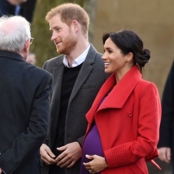 Le prince Harry, duc de Sussex, et Meghan Markle (enceinte), duchesse de Sussex, arrivent à Birkenhead, le 14 janvier 2019.