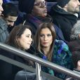 Claudia Tagbo, son compagnon et Malika Ménard (Miss France 2010) dans les tribunes du Parc des Princes lors du match de football de ligue 1 opposant le Paris Saint-Germain (PSG) au Stade rennais FC à Paris, le 27 janvier 2019. Le PSG a gagné 4-1.