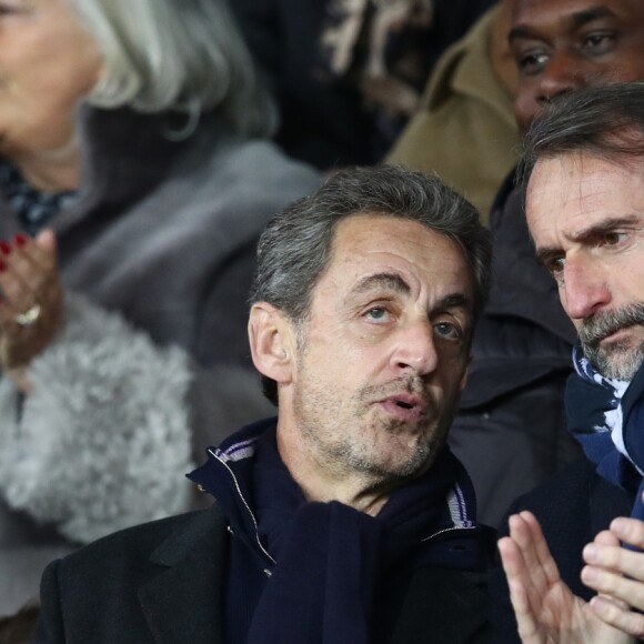 Nicolas Sarkozy et Jean-Claude Blanc (manager général du PSG) dans les tribunes du Parc des Princes lors du match de football de ligue 1 opposant le Paris Saint-Germain (PSG) au Stade rennais FC à Paris, le 27 janvier 2019. Le PSG a gagné 4-1.