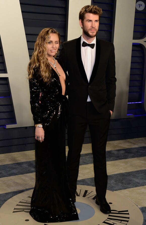 Miley Cyrus et son mari Liam Hemsworth à la soirée Vanity Fair Oscar Party à Los Angeles, le 24 février 2019