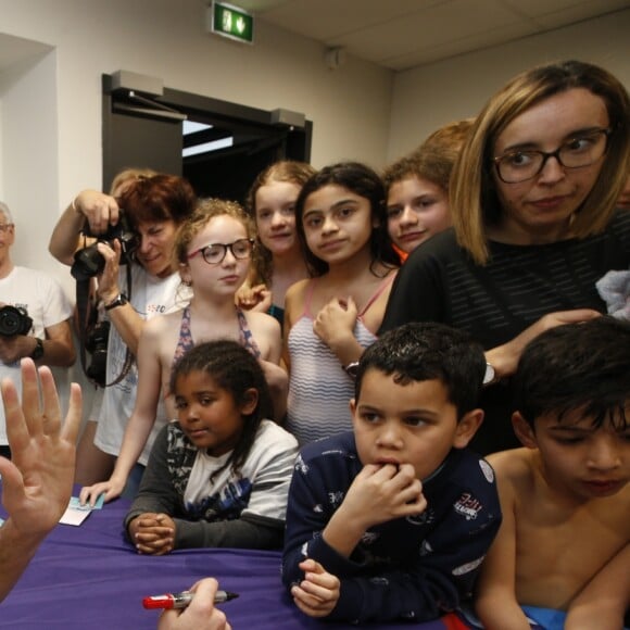 Exclusif - Camille Lacourt participe à une séance dédicaces à la piscine Vallier à Marseille à l'occasion de la 12 ème Nuit de l'Eau. Marseille, Le 23 Mars 2019.