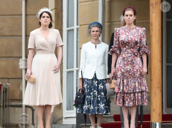 Les princesses Eugénie et Béatrice d'York lors de la garden party donnée à Buckingham Palace par la reine Elizabeth II le 29 mai 2019.