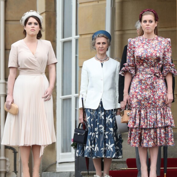 Les princesses Eugénie et Béatrice d'York lors de la garden party donnée à Buckingham Palace par la reine Elizabeth II le 29 mai 2019.