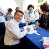 Christian Estrosi, le maire de Nice, dédicace son nouveau livre, "Nice, l'inattendue" durant la première journée du 24e festival du livre de Nice le 31 mai 2019. © Bruno Bebert/Bestimage