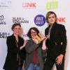 La militante Julia Boyer et les lauréates du meilleur documentaire Perrine Kervran et Annabelle Brouard au photocall de la 3e cérémonie des Out d'Or, qui célèbrent la visibilité des personnes LGBTI, au Cabaret Sauvage le 18 juin 2019.